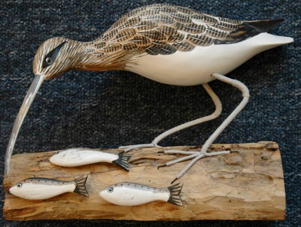 - a Sculpture by Wooden Birds, measuring 23 x 29 cm (H x W) £65